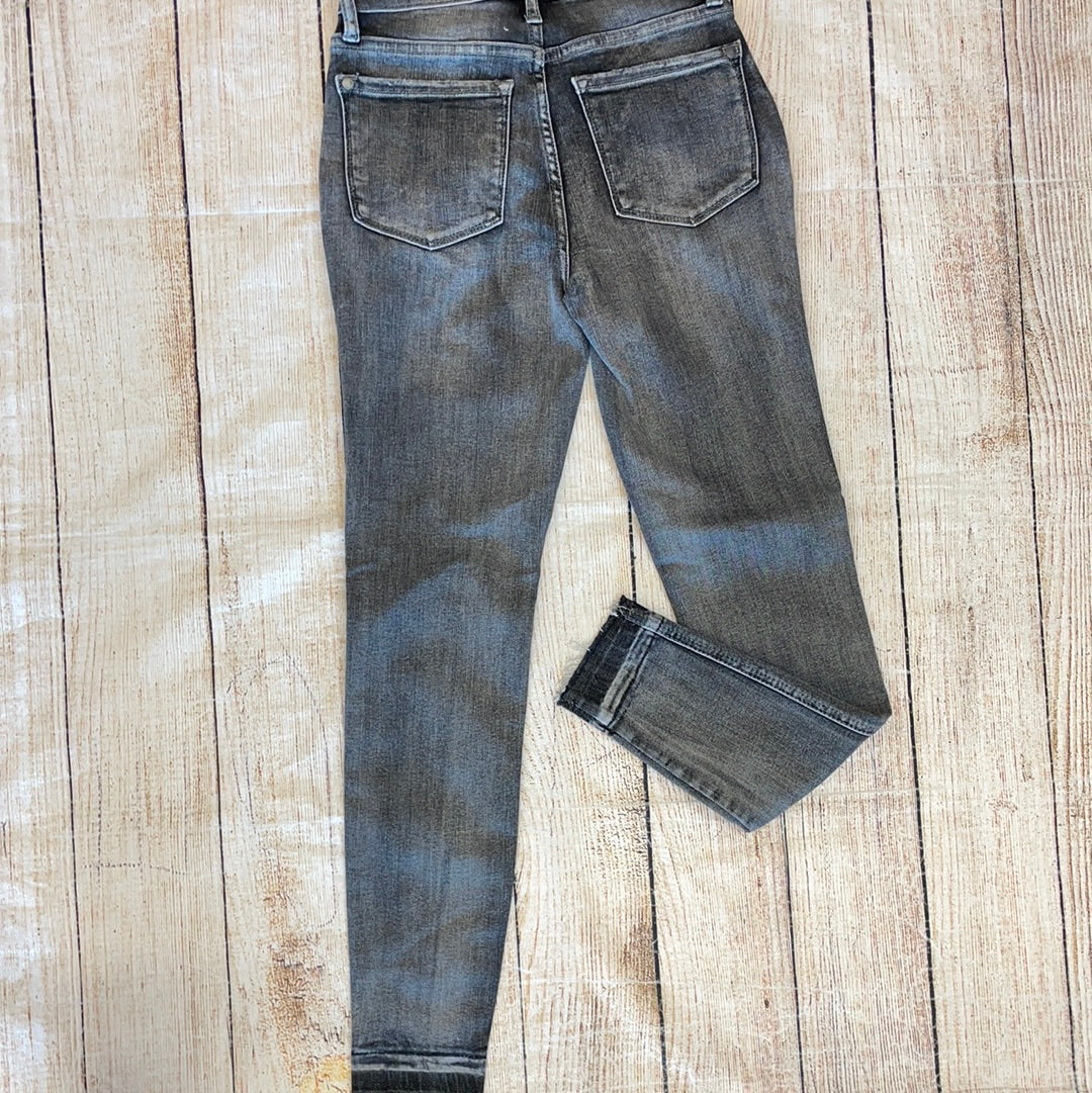 Judy Blue gray high-waisted jeans with heavy sanding.